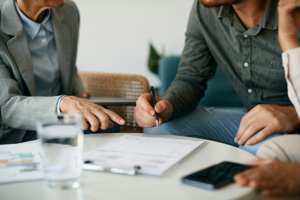 Meeting with paper and pen on table